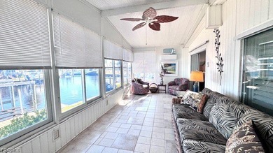 WATERFRONT HOME WITH BOAT DOCK/LIFT. Welcome to your dream home on Riverbend Golf and Country Club in Florida - for sale on GolfHomes.com, golf home, golf lot