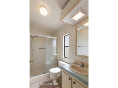 Welcome home to this mmaculate move-in-ready 2 bedroom 2 bath on Barefoot Bay Golf Course in Florida - for sale on GolfHomes.com, golf home, golf lot