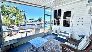 WATERFRONT HOME WITH BOAT DOCK/LIFT. Welcome to your dream home on Riverbend Golf and Country Club in Florida - for sale on GolfHomes.com, golf home, golf lot