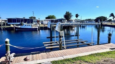WATERFRONT HOME WITH BOAT DOCK/LIFT. Welcome to your dream home on Riverbend Golf and Country Club in Florida - for sale on GolfHomes.com, golf home, golf lot