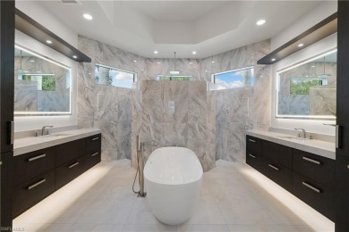 This fully renovated custom residence presents a rare on West Bay Beach and Golf Club in Florida - for sale on GolfHomes.com, golf home, golf lot