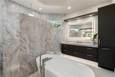 This fully renovated custom residence presents a rare on West Bay Beach and Golf Club in Florida - for sale on GolfHomes.com, golf home, golf lot