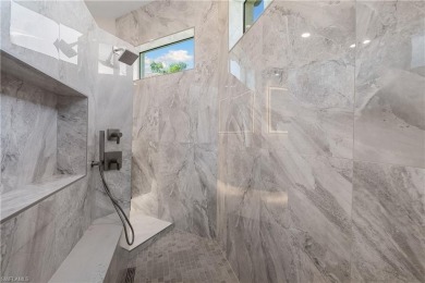 This fully renovated custom residence presents a rare on West Bay Beach and Golf Club in Florida - for sale on GolfHomes.com, golf home, golf lot