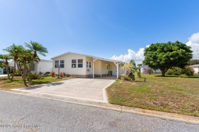 Welcome home to this mmaculate move-in-ready 2 bedroom 2 bath on Barefoot Bay Golf Course in Florida - for sale on GolfHomes.com, golf home, golf lot