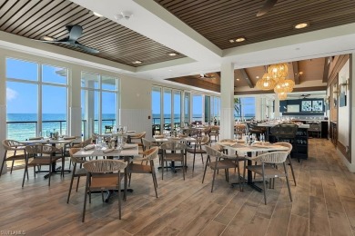 This fully renovated custom residence presents a rare on West Bay Beach and Golf Club in Florida - for sale on GolfHomes.com, golf home, golf lot