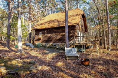 Adorable Cabin in the woods with red line behind the house and on Tannenbaum Golf Club in Arkansas - for sale on GolfHomes.com, golf home, golf lot