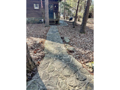 Adorable Cabin in the woods with red line behind the house and on Tannenbaum Golf Club in Arkansas - for sale on GolfHomes.com, golf home, golf lot