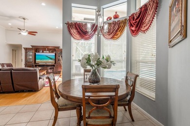 This updated home with NEW ROOF offers an open split floor plan on Binks Forest Golf Club in Florida - for sale on GolfHomes.com, golf home, golf lot