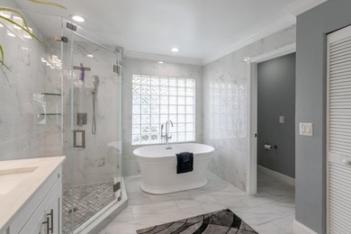 This updated home with NEW ROOF offers an open split floor plan on Binks Forest Golf Club in Florida - for sale on GolfHomes.com, golf home, golf lot