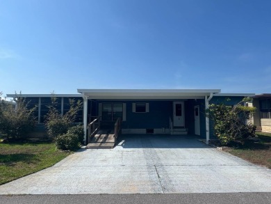 Take a look at this charming and spacious partially furnished on Lake Henry Golf Club in Florida - for sale on GolfHomes.com, golf home, golf lot