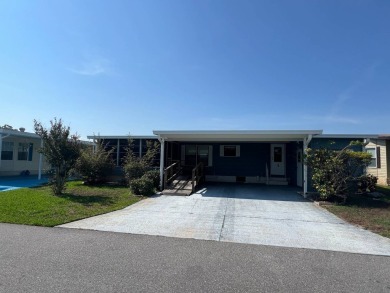Take a look at this charming and spacious partially furnished on Lake Henry Golf Club in Florida - for sale on GolfHomes.com, golf home, golf lot