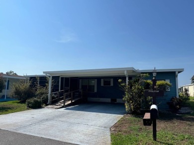 Take a look at this charming and spacious partially furnished on Lake Henry Golf Club in Florida - for sale on GolfHomes.com, golf home, golf lot