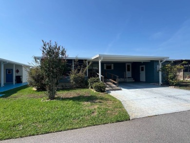 Take a look at this charming and spacious partially furnished on Lake Henry Golf Club in Florida - for sale on GolfHomes.com, golf home, golf lot