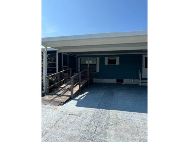 Take a look at this charming and spacious partially furnished on Lake Henry Golf Club in Florida - for sale on GolfHomes.com, golf home, golf lot