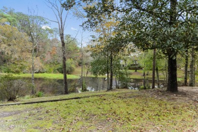 Welcome to your dream home overlooking a serene pond in the on Mississippi National Golf Course in Mississippi - for sale on GolfHomes.com, golf home, golf lot