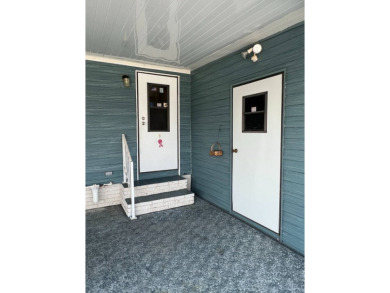 Take a look at this charming and spacious partially furnished on Lake Henry Golf Club in Florida - for sale on GolfHomes.com, golf home, golf lot