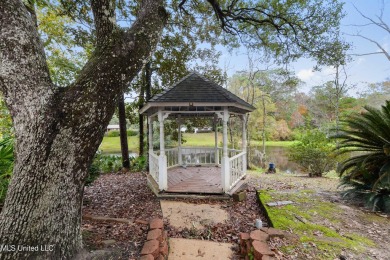 Welcome to your dream home overlooking a serene pond in the on Mississippi National Golf Course in Mississippi - for sale on GolfHomes.com, golf home, golf lot