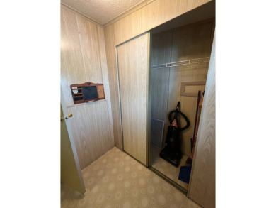 Take a look at this charming and spacious partially furnished on Lake Henry Golf Club in Florida - for sale on GolfHomes.com, golf home, golf lot