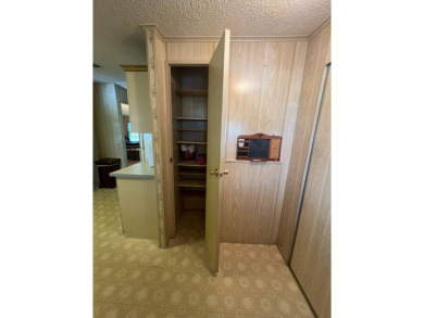 Take a look at this charming and spacious partially furnished on Lake Henry Golf Club in Florida - for sale on GolfHomes.com, golf home, golf lot