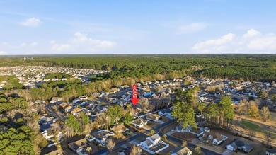 Welcome home to this warm and inviting 4-bedroom, 2-bath home on Palmetto Greens Golf and Country Club in South Carolina - for sale on GolfHomes.com, golf home, golf lot
