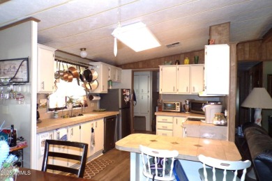 Golf Course Manufactured Home  on large lot with a 2 car garage on Queen Valley Golf Course in Arizona - for sale on GolfHomes.com, golf home, golf lot
