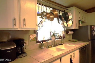 Golf Course Manufactured Home  on large lot with a 2 car garage on Queen Valley Golf Course in Arizona - for sale on GolfHomes.com, golf home, golf lot