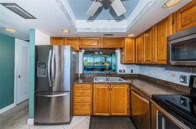 This 2-bedroom, 2-bath condo has a unique remodel with a privacy on Cove Cay Country Club in Florida - for sale on GolfHomes.com, golf home, golf lot