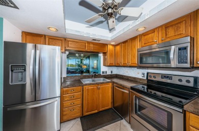 This 2-bedroom, 2-bath condo has a unique remodel with a privacy on Cove Cay Country Club in Florida - for sale on GolfHomes.com, golf home, golf lot