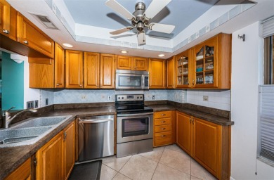 This 2-bedroom, 2-bath condo has a unique remodel with a privacy on Cove Cay Country Club in Florida - for sale on GolfHomes.com, golf home, golf lot