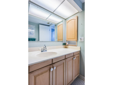 This 2-bedroom, 2-bath condo has a unique remodel with a privacy on Cove Cay Country Club in Florida - for sale on GolfHomes.com, golf home, golf lot