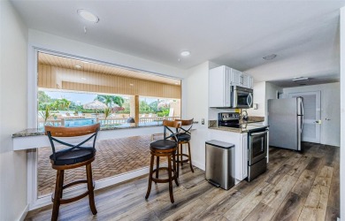 This 2-bedroom, 2-bath condo has a unique remodel with a privacy on Cove Cay Country Club in Florida - for sale on GolfHomes.com, golf home, golf lot