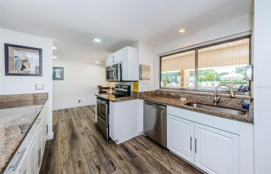 This 2-bedroom, 2-bath condo has a unique remodel with a privacy on Cove Cay Country Club in Florida - for sale on GolfHomes.com, golf home, golf lot