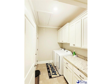 Welcome to 309 Dormie Lane, a luxury residence located behind on The Members Club At Woodcreek in South Carolina - for sale on GolfHomes.com, golf home, golf lot