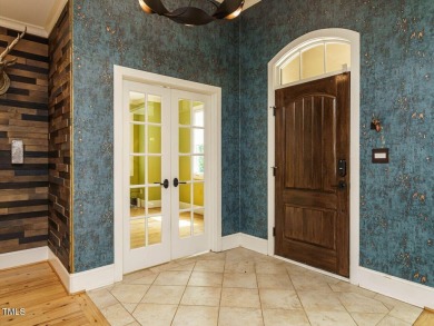Experience refined living in this custom 4-bdrm/3-bath tucked on The Preserve At Jordan Lake Golf Club in North Carolina - for sale on GolfHomes.com, golf home, golf lot