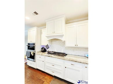 Welcome to 309 Dormie Lane, a luxury residence located behind on The Members Club At Woodcreek in South Carolina - for sale on GolfHomes.com, golf home, golf lot