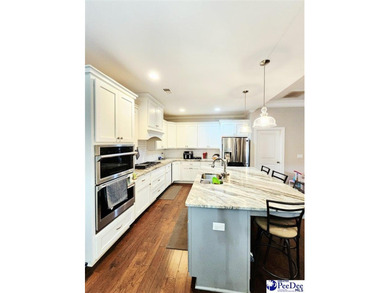 Welcome to 309 Dormie Lane, a luxury residence located behind on The Members Club At Woodcreek in South Carolina - for sale on GolfHomes.com, golf home, golf lot