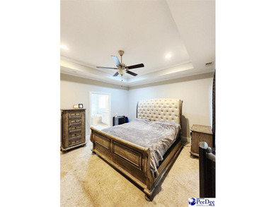 Welcome to 309 Dormie Lane, a luxury residence located behind on The Members Club At Woodcreek in South Carolina - for sale on GolfHomes.com, golf home, golf lot