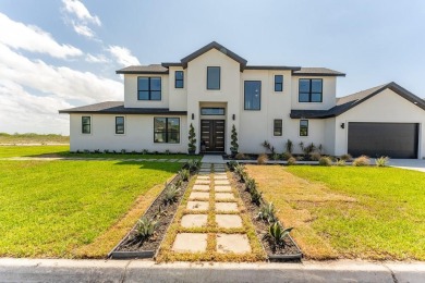 Discover luxury lakeside living in the prestigious gated on South Padre Island Golf Club in Texas - for sale on GolfHomes.com, golf home, golf lot