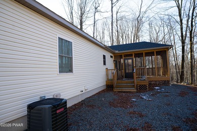 Enjoy easy one-level living in this next-to-new contemporary on The Hideout Golf in Pennsylvania - for sale on GolfHomes.com, golf home, golf lot