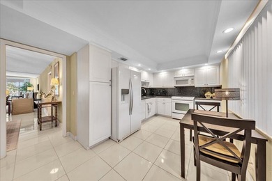 Spacious and updated 3BR/2.5BA *F* model with tile & laminate on  in Florida - for sale on GolfHomes.com, golf home, golf lot