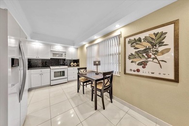 Spacious and updated 3BR/2.5BA *F* model with tile & laminate on  in Florida - for sale on GolfHomes.com, golf home, golf lot