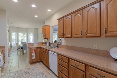 Welcome to this charming brick-front home tucked inside the on Brunswick Plantation and Golf Resorts in North Carolina - for sale on GolfHomes.com, golf home, golf lot