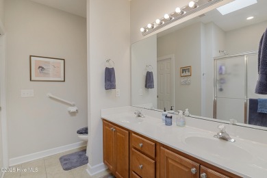Welcome to this charming brick-front home tucked inside the on Brunswick Plantation and Golf Resorts in North Carolina - for sale on GolfHomes.com, golf home, golf lot