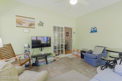 Welcome to this charming brick-front home tucked inside the on Brunswick Plantation and Golf Resorts in North Carolina - for sale on GolfHomes.com, golf home, golf lot