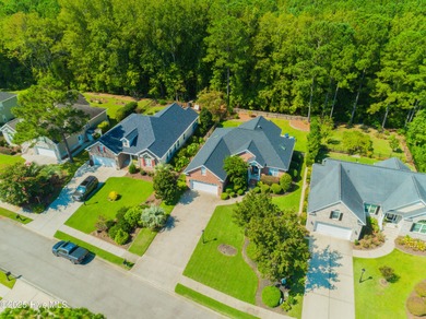 Welcome to this charming brick-front home tucked inside the on Brunswick Plantation and Golf Resorts in North Carolina - for sale on GolfHomes.com, golf home, golf lot