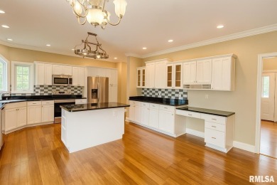Located on a spacious corner lot just steps from the driving on WeaverRidge Golf Club in Illinois - for sale on GolfHomes.com, golf home, golf lot