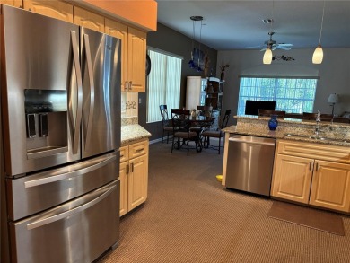 Welcome to this beautiful home, impeccably cared for, and on Meadow Oaks Golf and Country Club in Florida - for sale on GolfHomes.com, golf home, golf lot