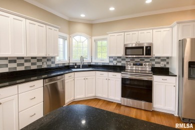 Located on a spacious corner lot just steps from the driving on WeaverRidge Golf Club in Illinois - for sale on GolfHomes.com, golf home, golf lot