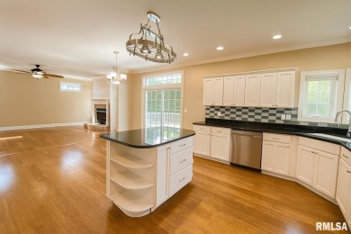 Located on a spacious corner lot just steps from the driving on WeaverRidge Golf Club in Illinois - for sale on GolfHomes.com, golf home, golf lot