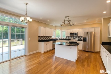Located on a spacious corner lot just steps from the driving on WeaverRidge Golf Club in Illinois - for sale on GolfHomes.com, golf home, golf lot